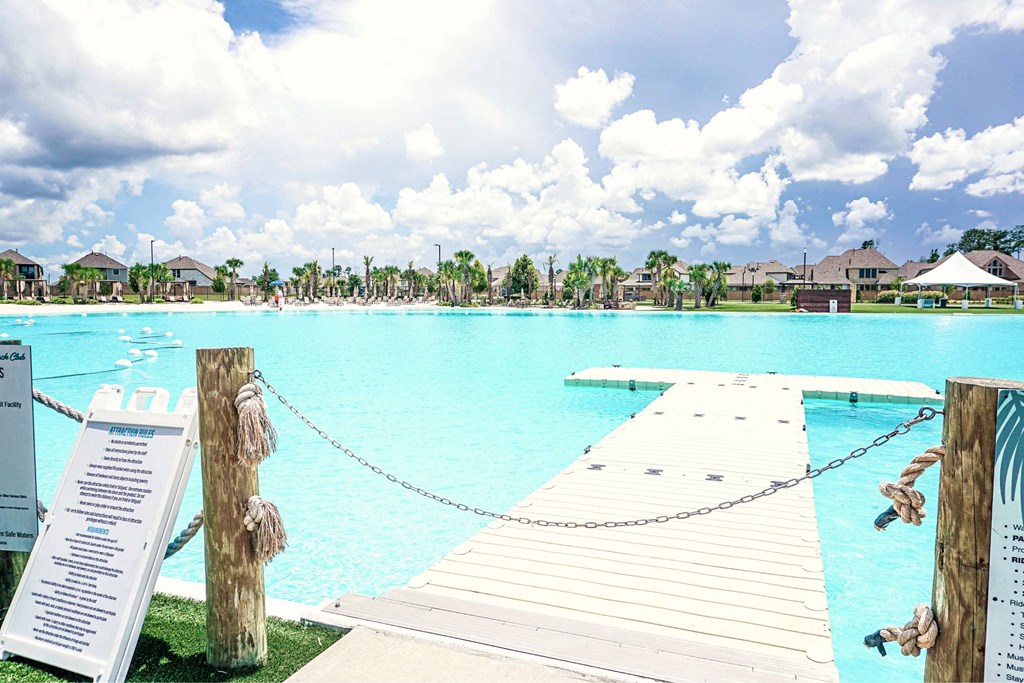 A pool with a sign on the side.