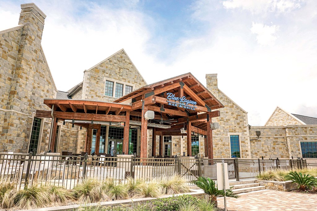 A building with a wooden entrance and a sign that says "Blue Ribbon".