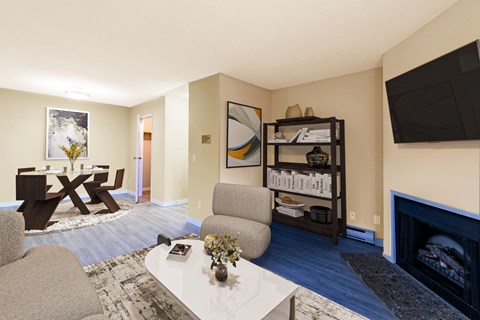 a living room with a couch and a table and a television