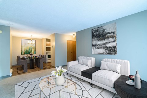 a living room with a white couch and a table