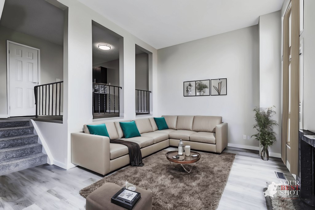 an open living room with a couch and a coffee table
