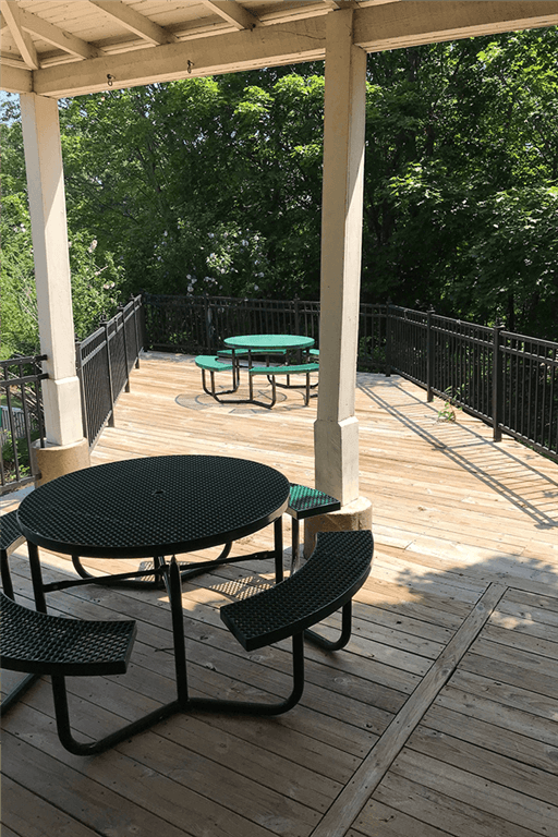 View of Silvertree Apartments Sundeck with trees in background