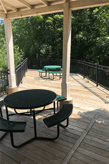 View of Silvertree Apartments Sundeck with trees in background - Photo Gallery 19