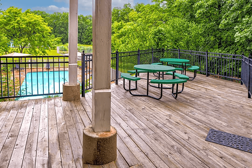 Silvertree Apartments Sundeck View of Silvertree Apartments Sundeck overlooking pool with trees in background
