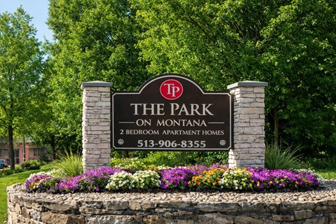 A sign for The Park on Montana, a 2 bedroom apartment complex, with a phone number listed.