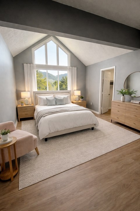 A bedroom with a large bed, a window with a view of trees, and a wooden nightstand with a plant on top.