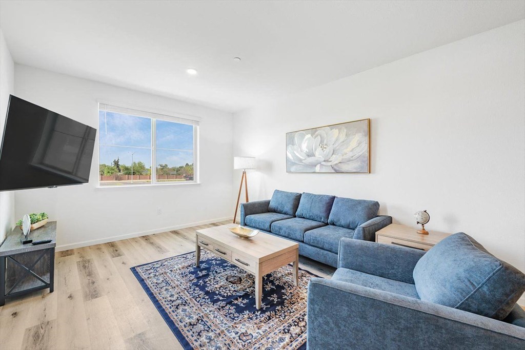a living room with a couch and a tv
