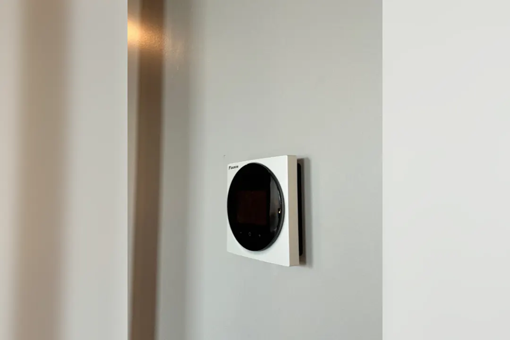 a modern light switch on a white wall