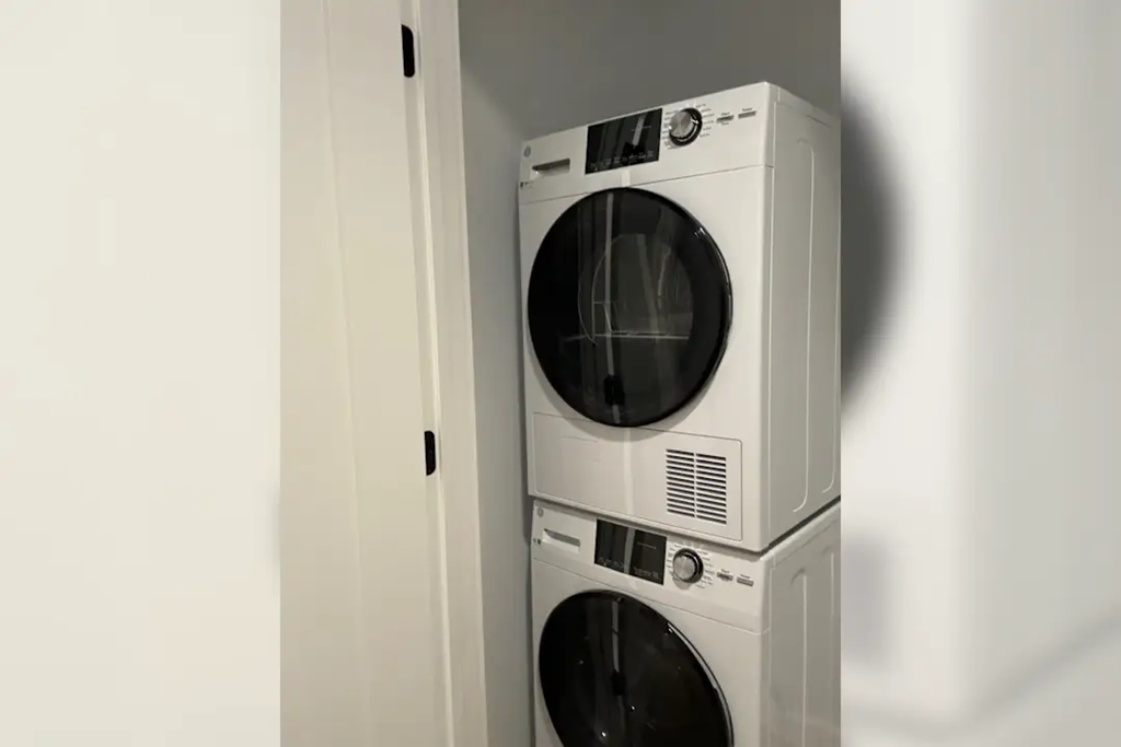 a white washer and dryer in a white room