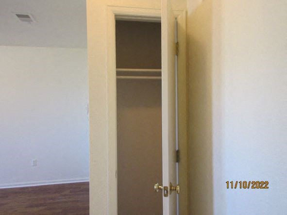 an open door in a room with a closet