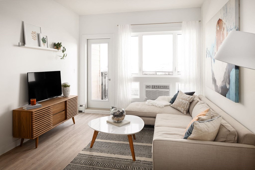 a living room with a couch and a table and a television