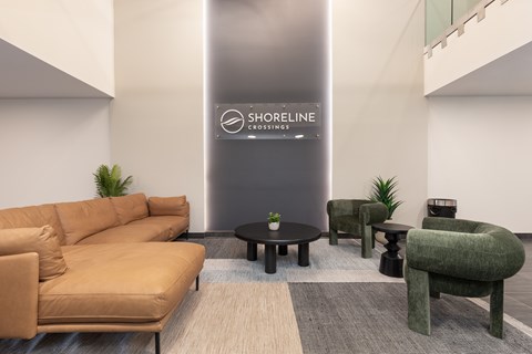 A modern living room with a Shoreline sign on the wall.