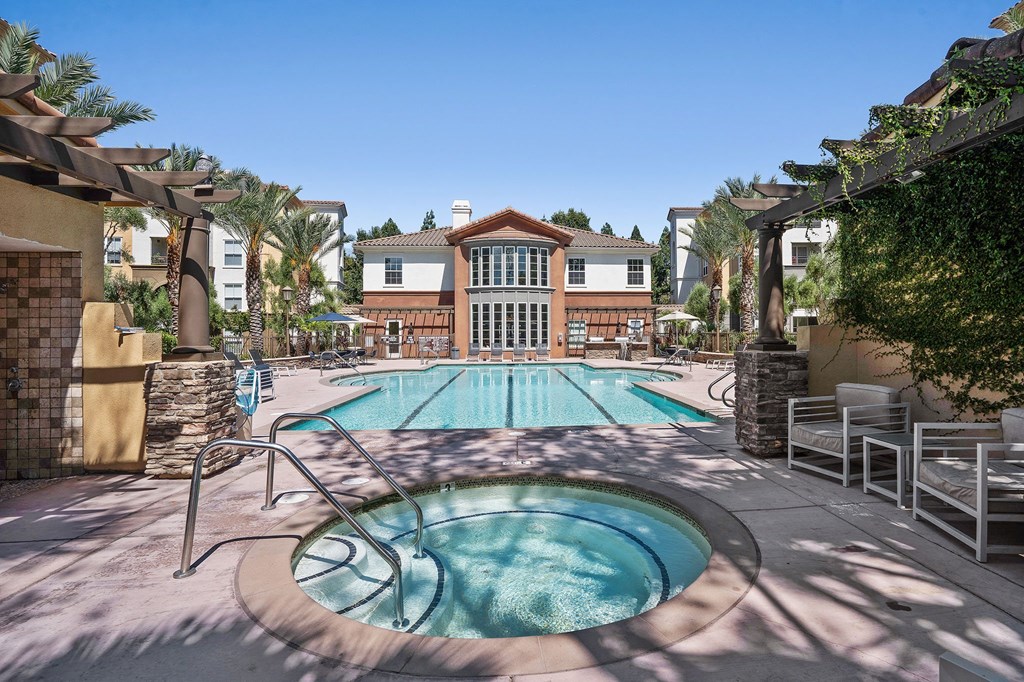 a swimming pool with a house in the background