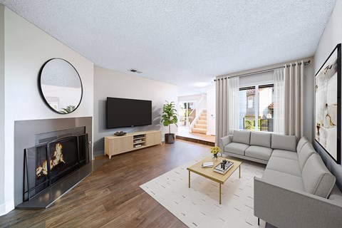 A modern living room with a fireplace and a television.