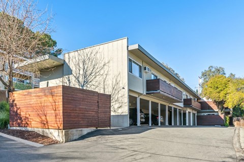 A modern building with a combination of wood and concrete materials.