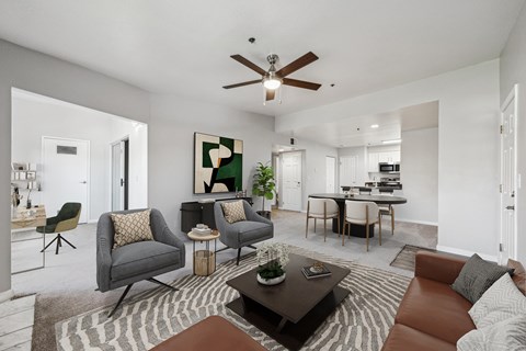 A living room with a brown leather couch and a coffee table.