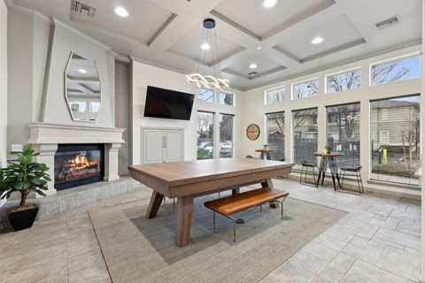 A modern dining room with a wooden table and bench.