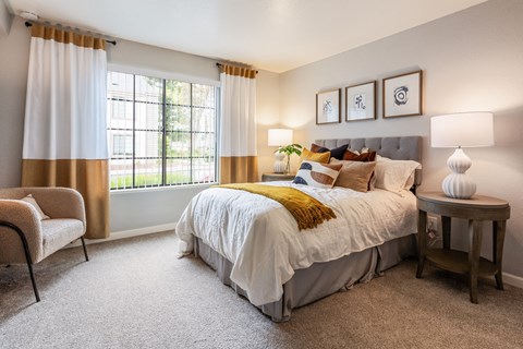 a bedroom with a bed and a window