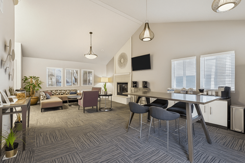 A modern living room with a grey carpet and furniture.