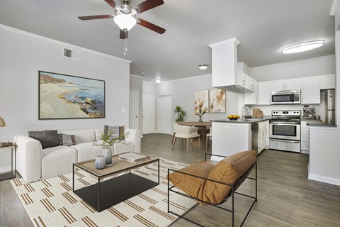 A modern living room with a white couch and a coffee table.