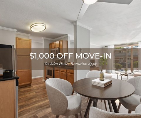 A modern kitchen with a dining table and chairs, offering a $1,000 off move-in deal on select homes.