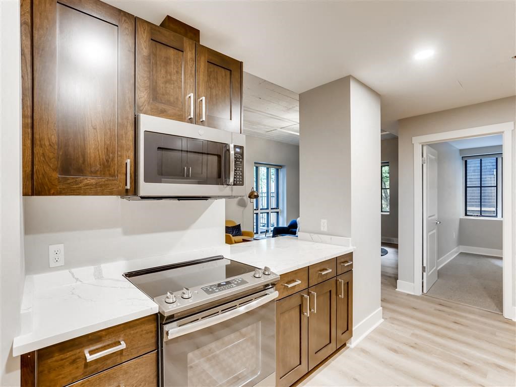 a kitchen with a stove and a microwave