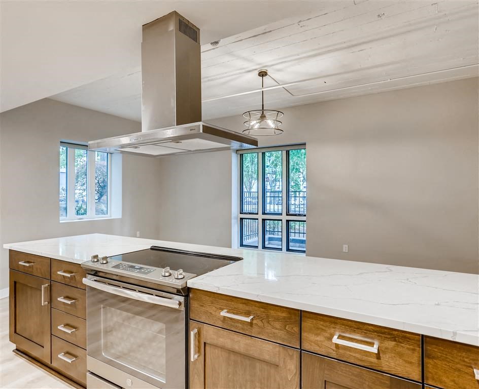 a kitchen with a stove top oven and a counter top