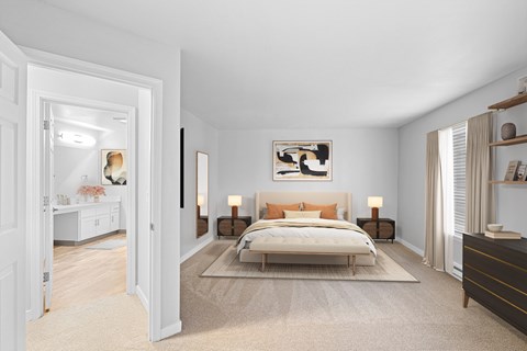 A bedroom with a large bed and a painting on the wall.