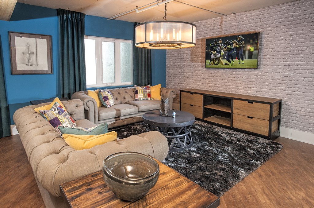 a living room with blue walls and a couch and a table