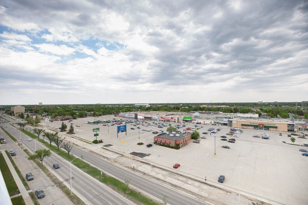 an aerial view of a parking lot in a city
