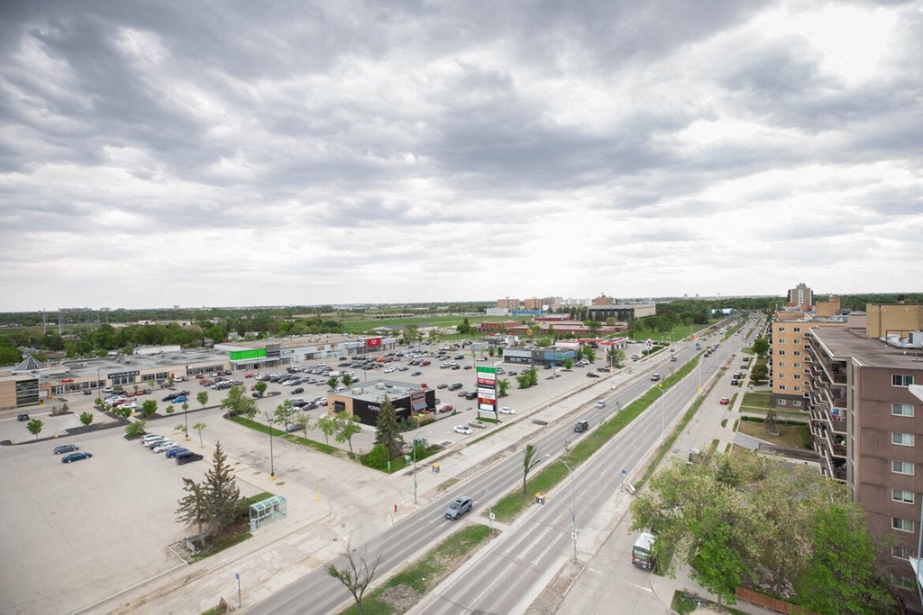 an aerial view of a city with traffic and buildings