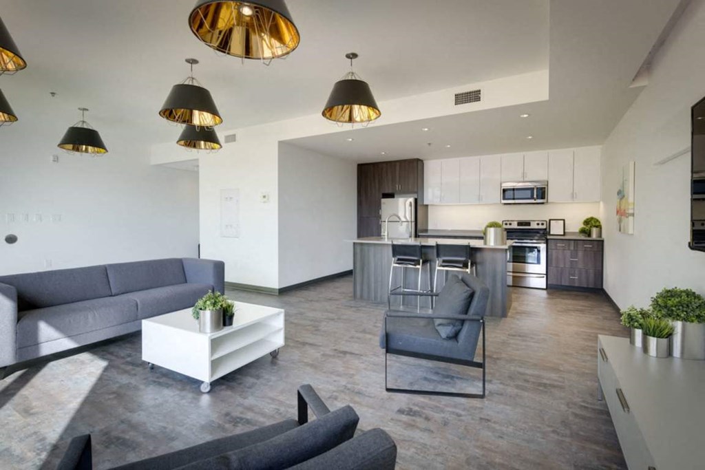 a rendering of a living room and kitchen in a building