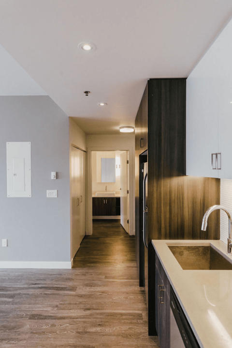 a kitchen with a sink and a refrigerator