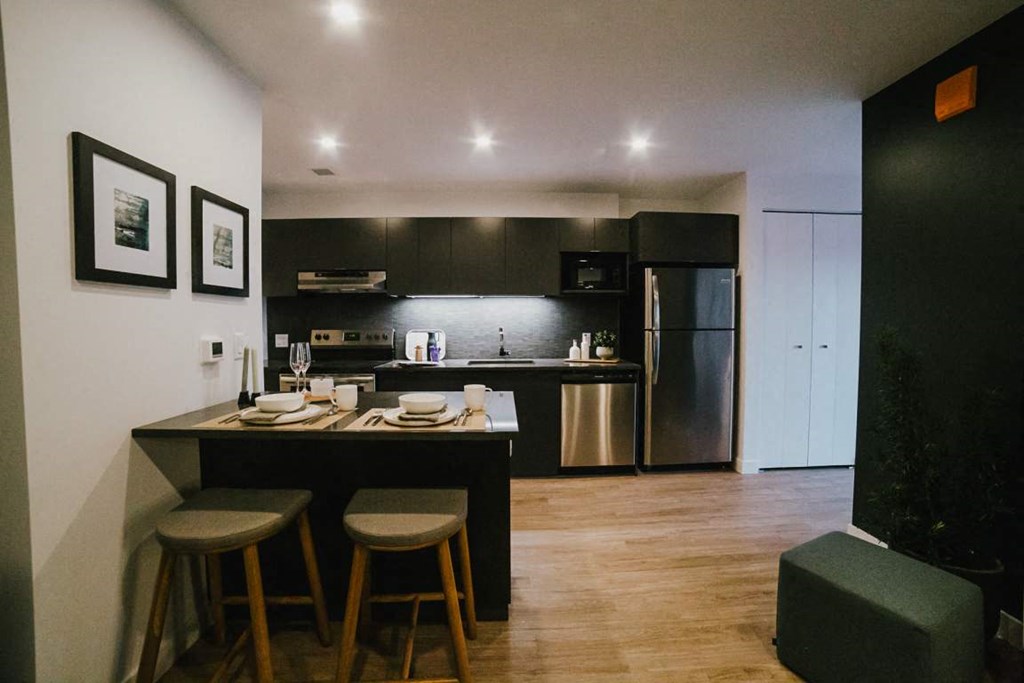 an open kitchen and dining room with a table and chairs