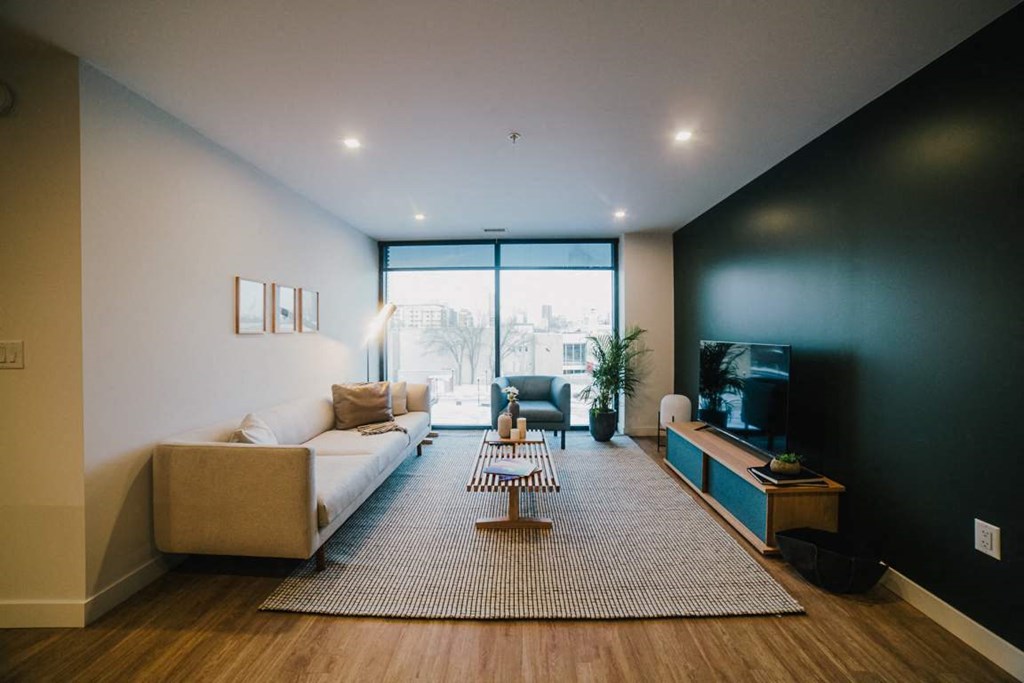 a living room with a couch and a table