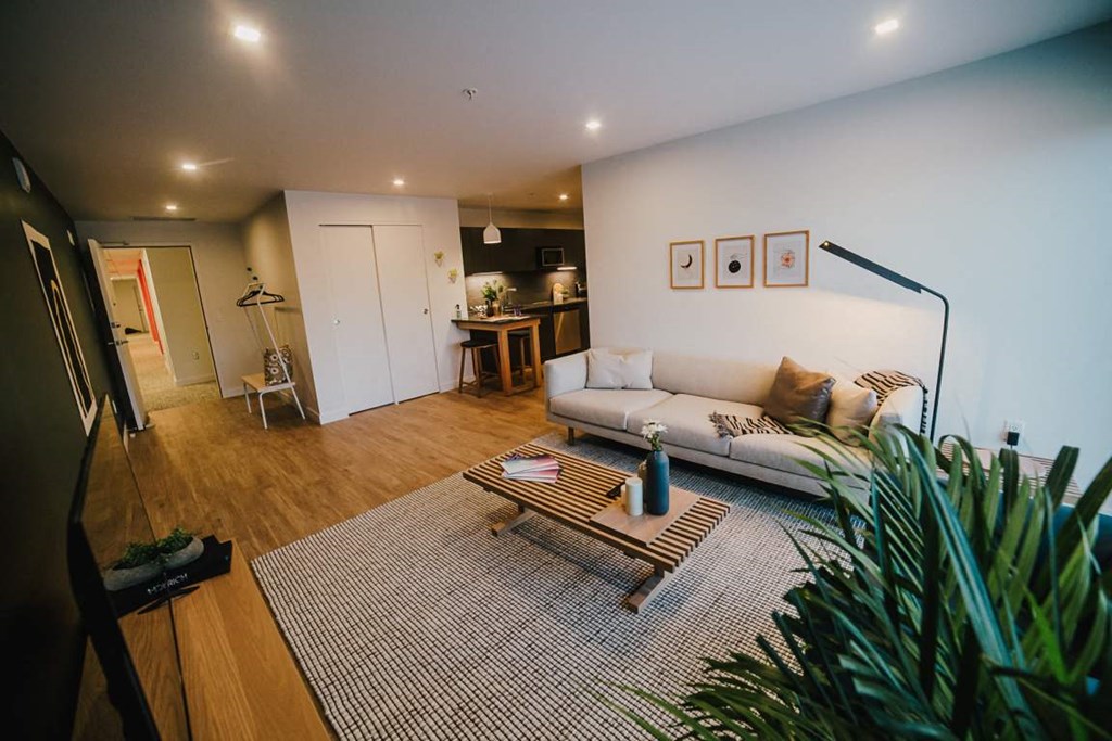 a living room with a couch and a table