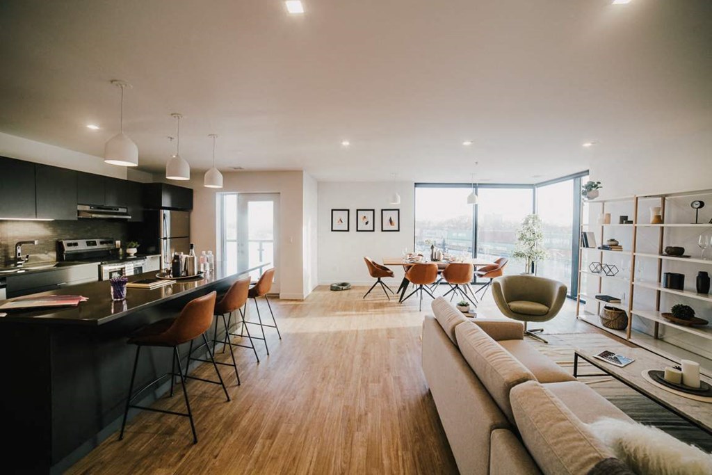a living room with a kitchen and a dining room