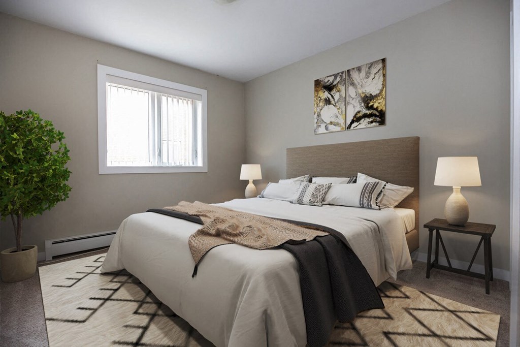 a bedroom with a large bed and a window