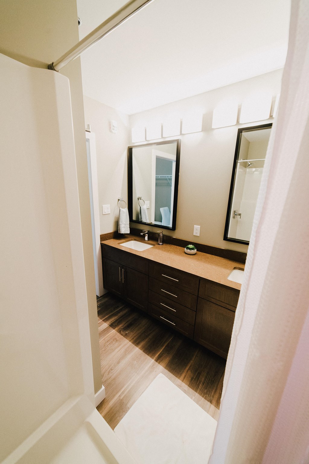 the view of a bathroom with a sink and a mirror