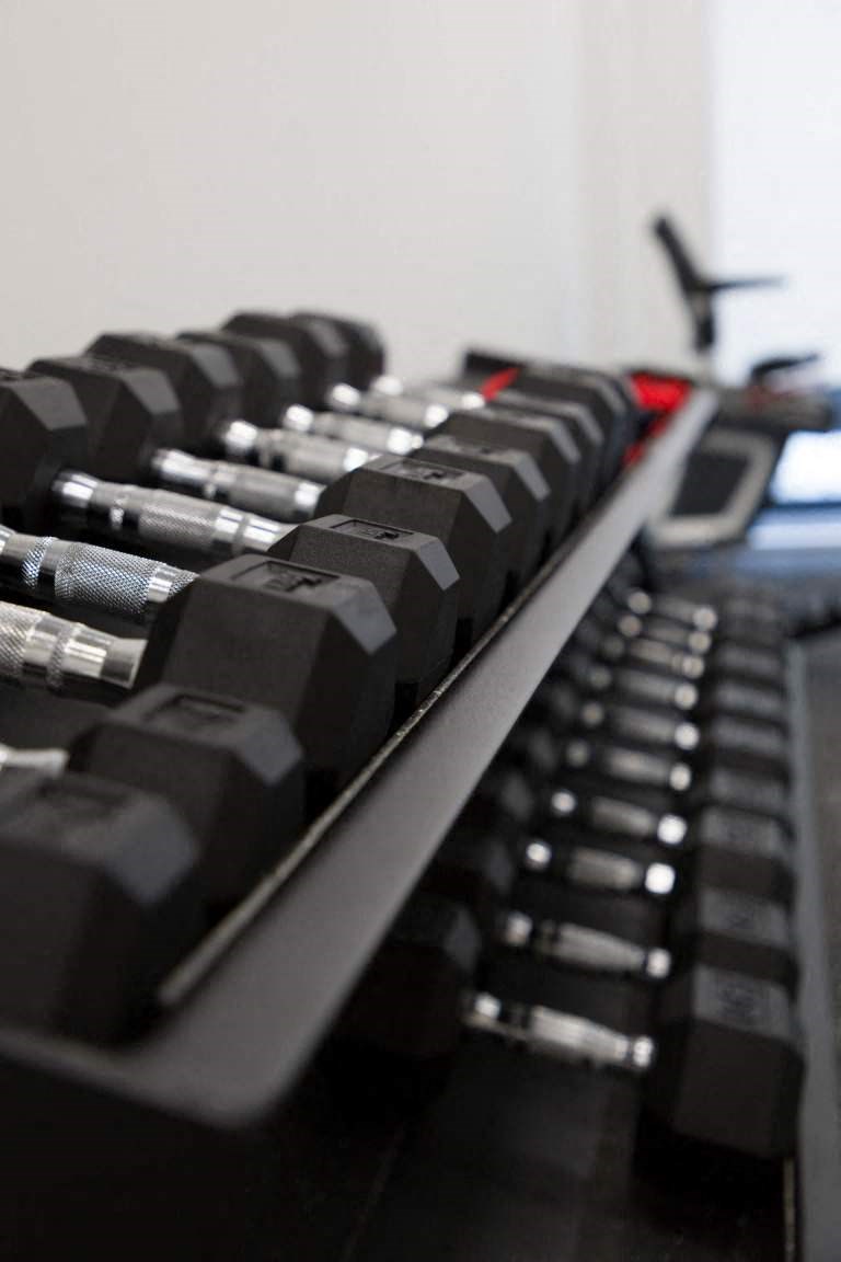 a close up of a row of black keyboards