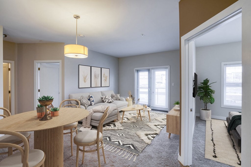 a living room and dining room with a couch and a table