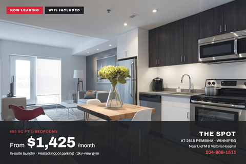 A modern kitchen with a dining table and chairs is on display for lease.