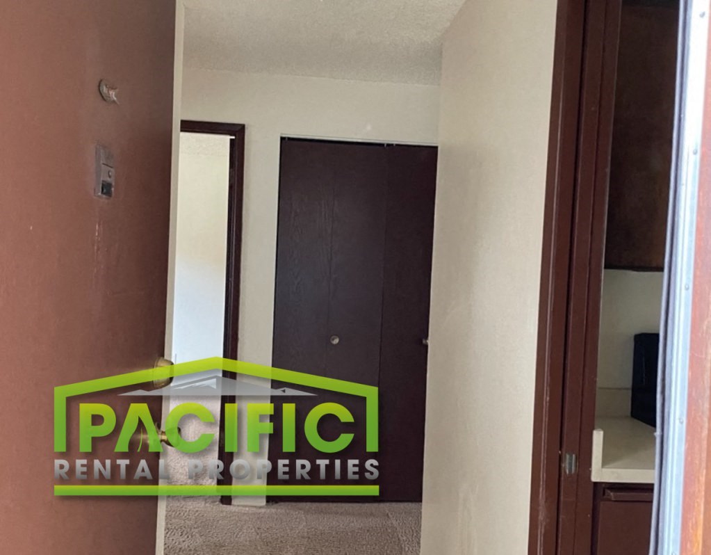 a small room with a closet and a door to a bathroom