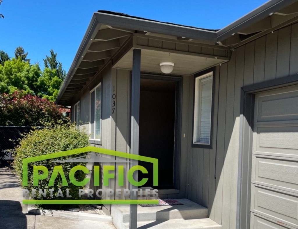 a front door of a house with a green logo