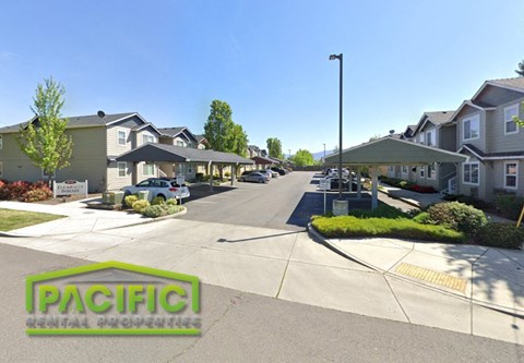 an empty street with houses on both sides of it
