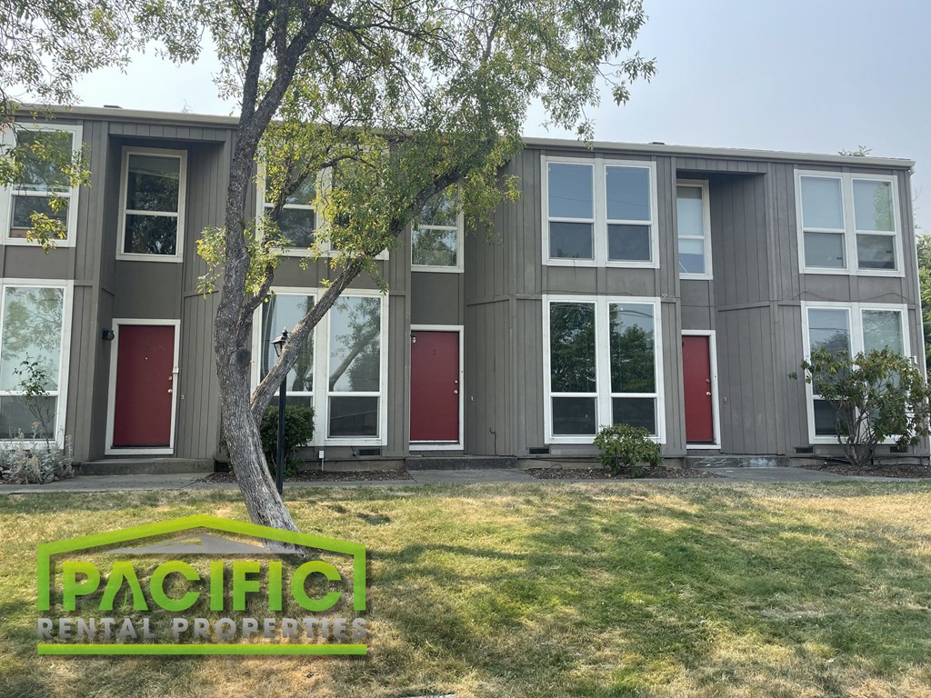 a building with a tree in front of it