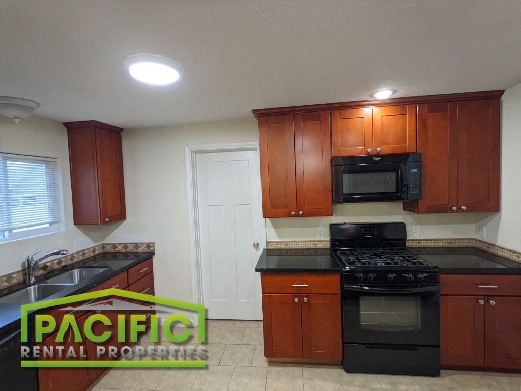 a kitchen with a stove and a microwave