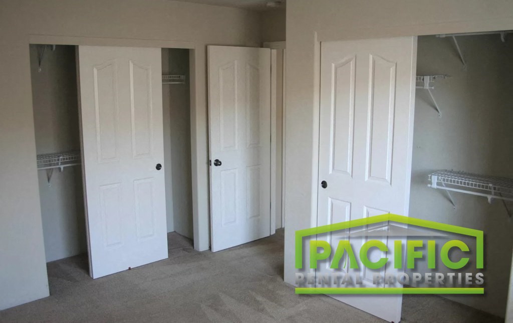 a room with three closets and three doors