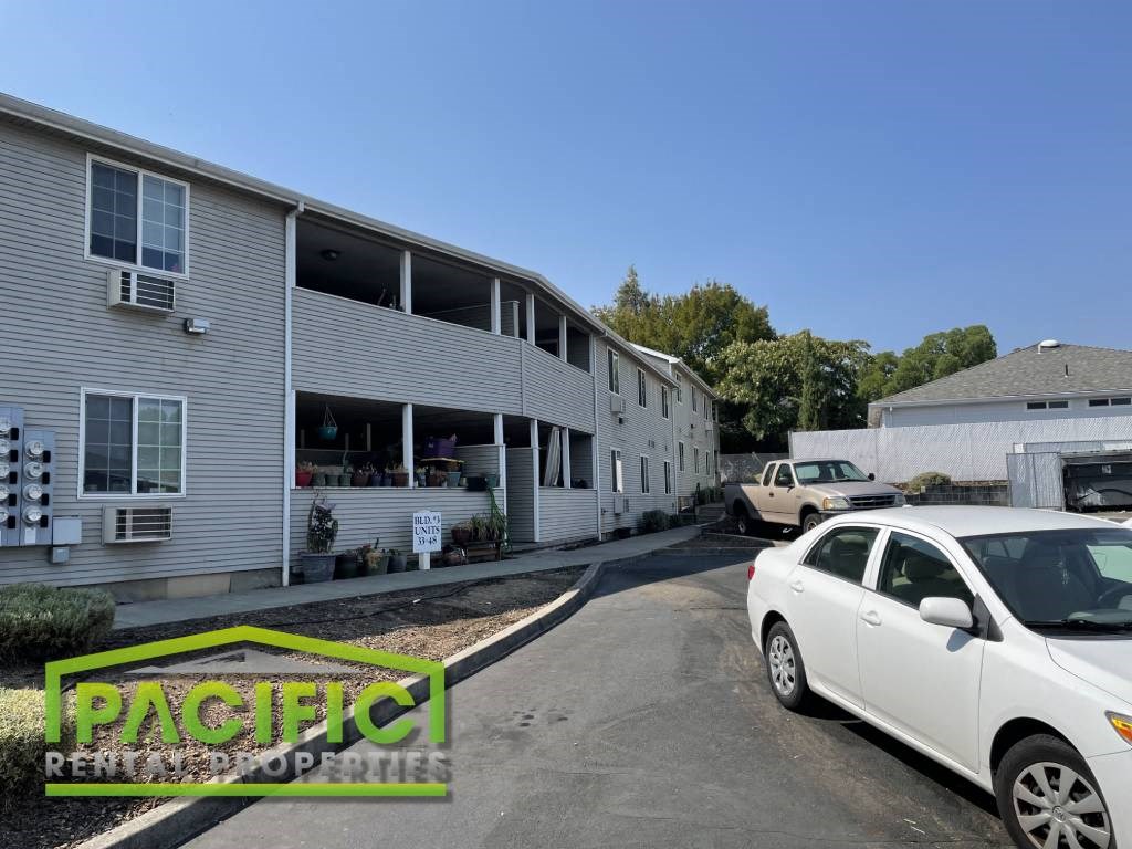 a building with a white car parked in front of it
