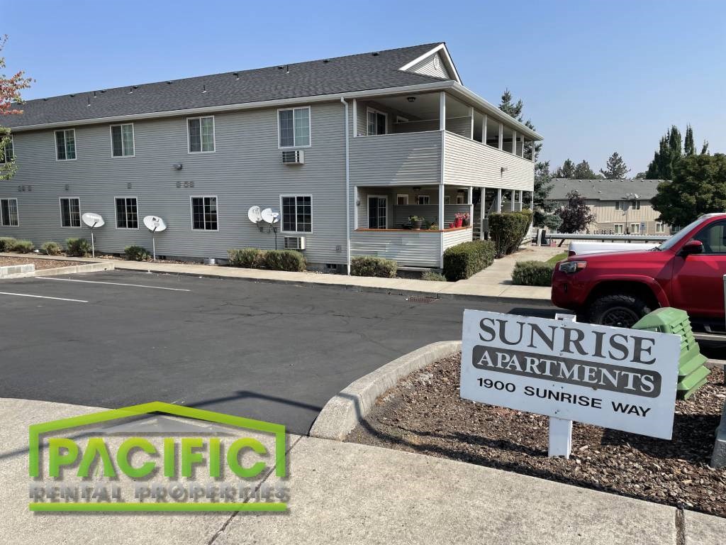 a house for sale is shown at the corner of a parking lot